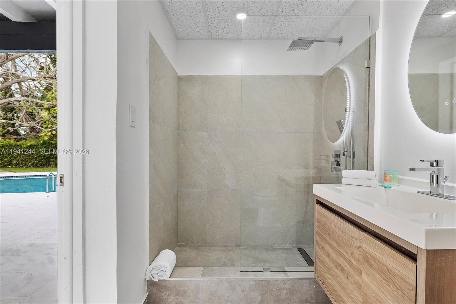 10361 Southwest 119th Street Miami, FL 33176 - Photo 35 of 38 a bathroom with a sink and a mirror
