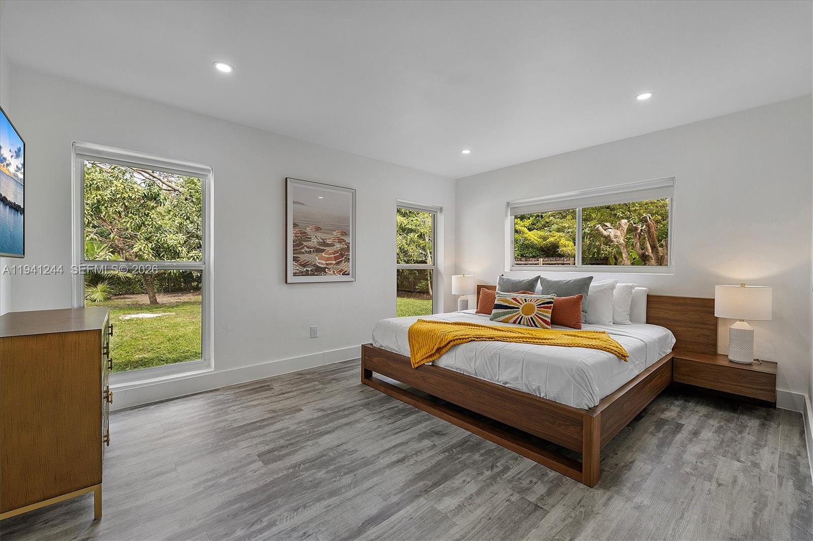 10361 Southwest 119th Street Miami, FL 33176 - Photo 4 of 38 a bedroom with a bed and window