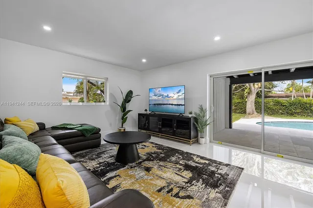a living room with furniture and a flat screen tv