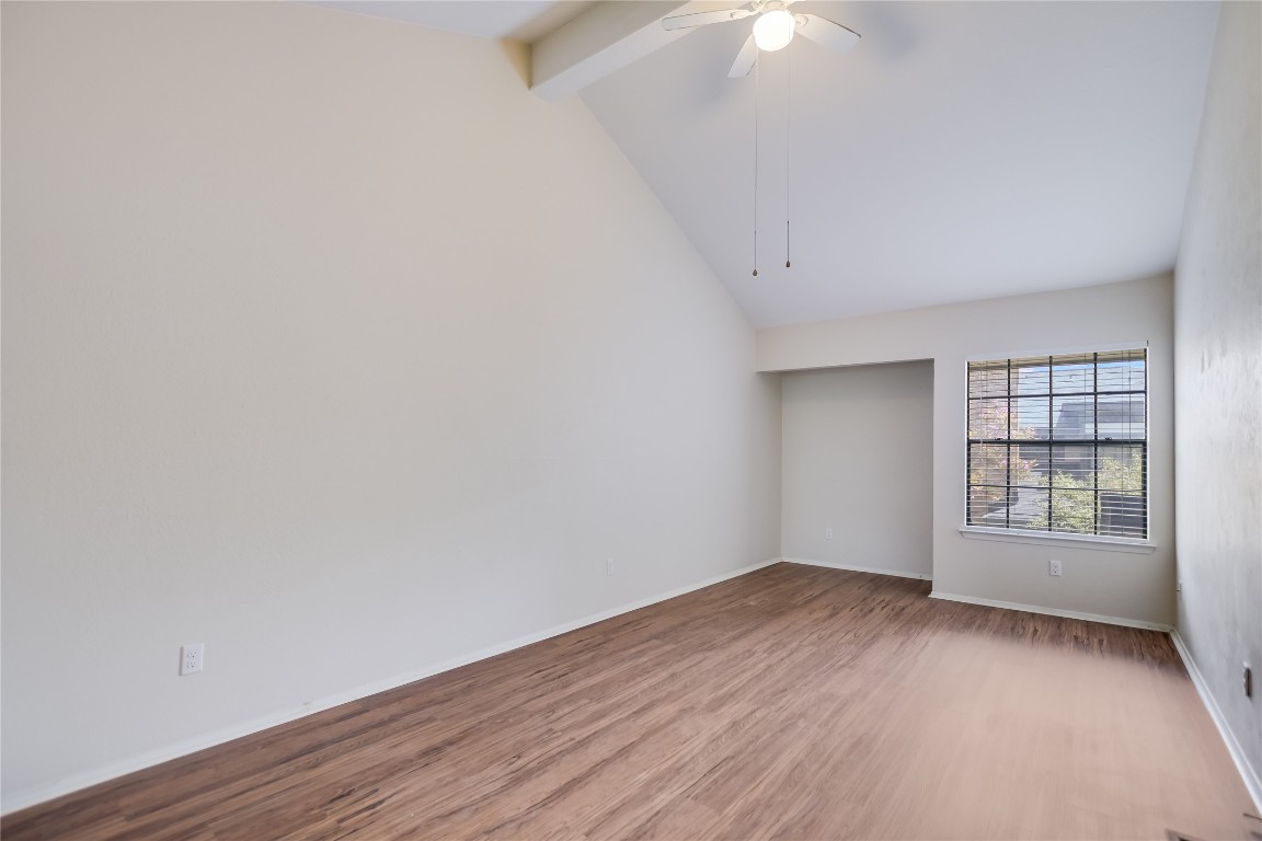 1748 Ohlen Road, Unit 36 Austin, TX 78757 - Photo 12 of 21 wooden floor in an empty room with a window