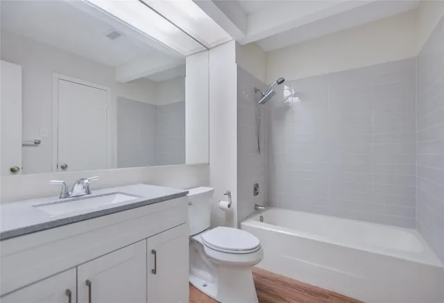 a bathroom with a sink a toilet and a bathtub