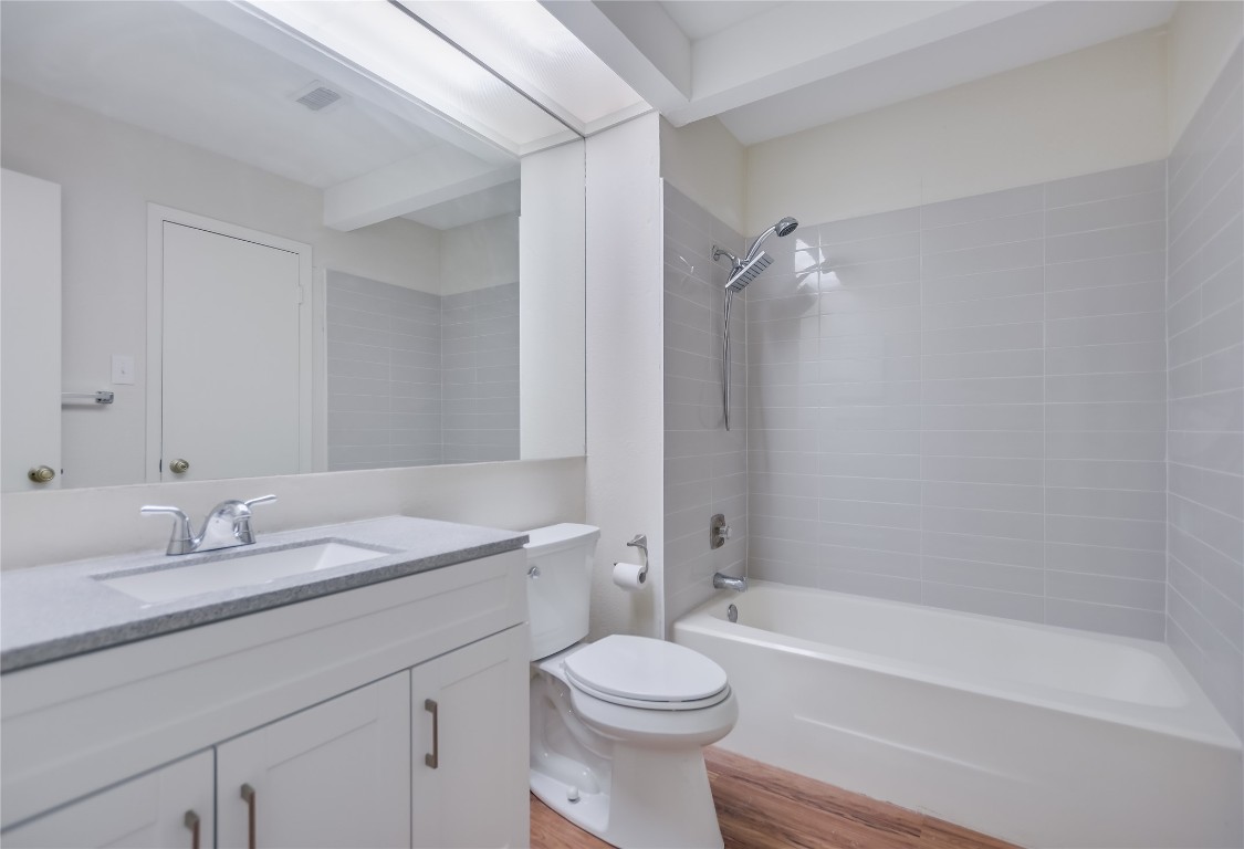 1748 Ohlen Road, Unit 36 Austin, TX 78757 - Photo 13 of 21 a bathroom with a sink a toilet and a bathtub