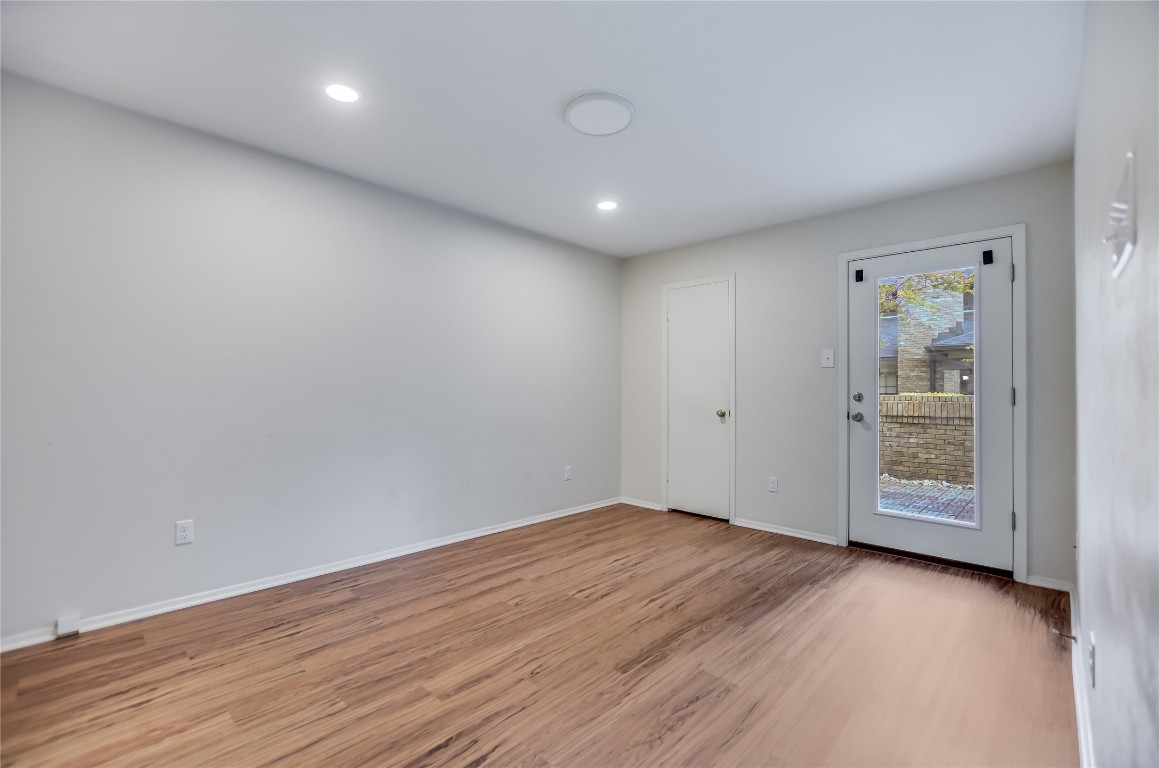 1748 Ohlen Road, Unit 36 Austin, TX 78757 - Photo 14 of 21 an empty room with wooden floor and windows