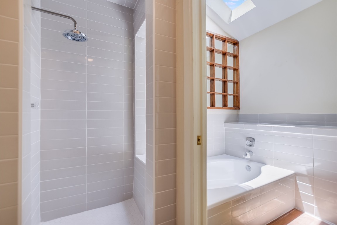 1748 Ohlen Road, Unit 36 Austin, TX 78757 - Photo 17 of 21 a bathroom with a tub and a shower