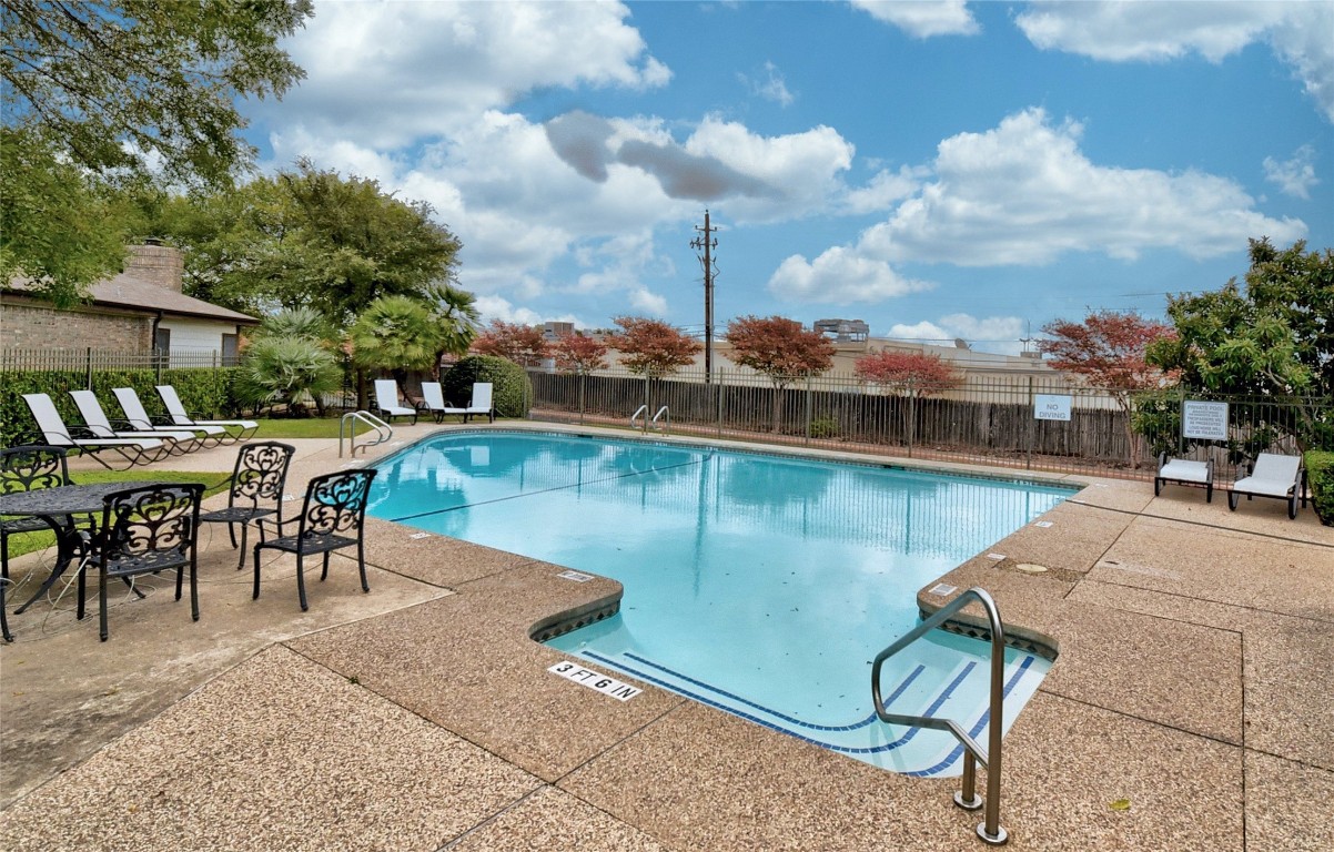 1748 Ohlen Road, Unit 36 Austin, TX 78757 - Photo 21 of 21 a view of a swimming pool with chairs in patio