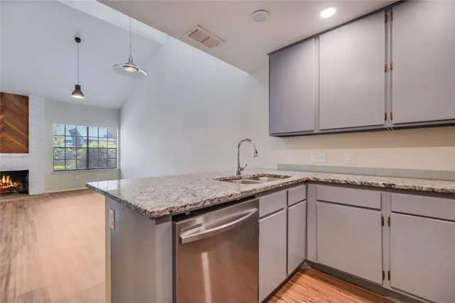 a kitchen with a sink and cabinets