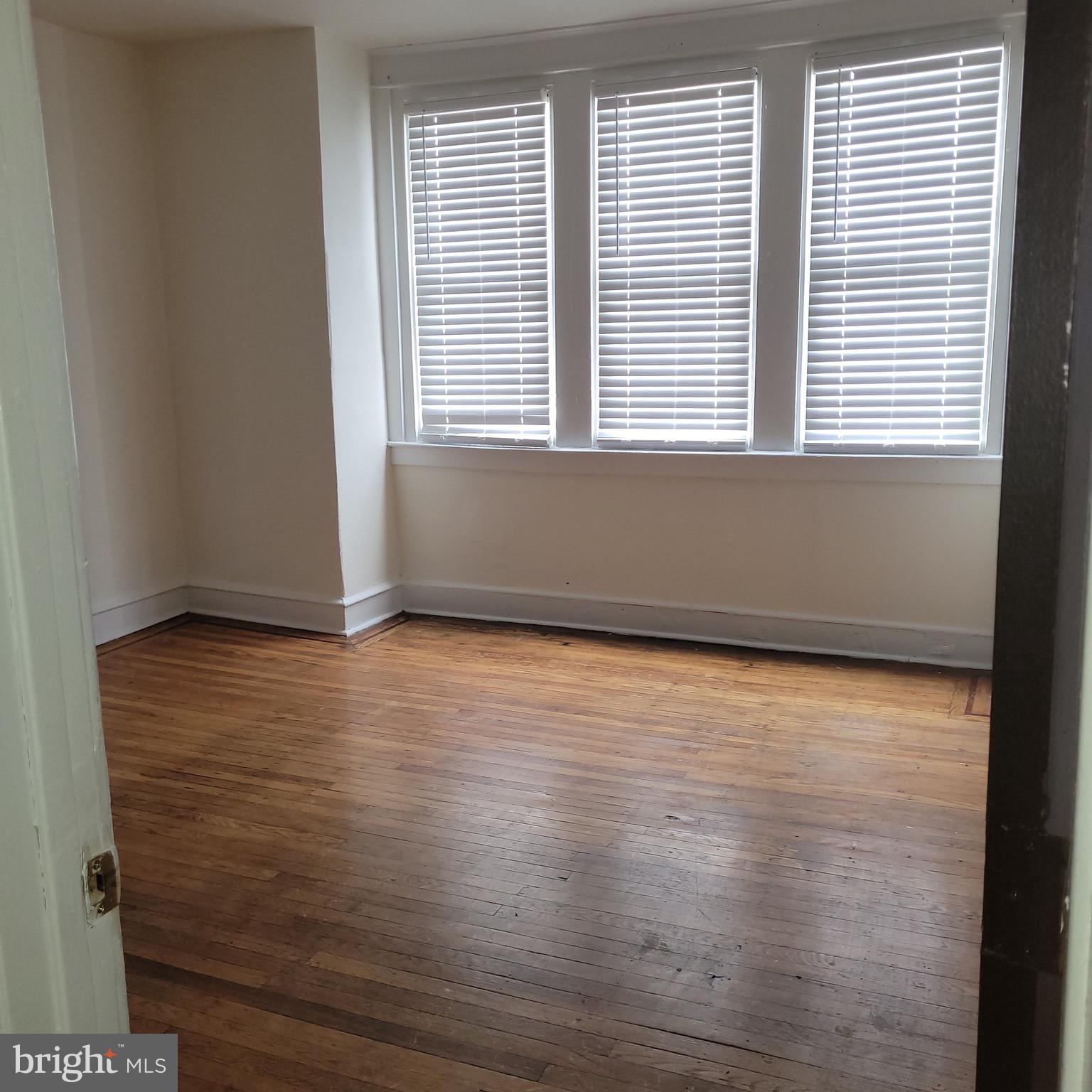 5581 Blakemore Street Philadelphia, PA 19138 - Photo 13 of 14 a view of a room with wooden floor and a window