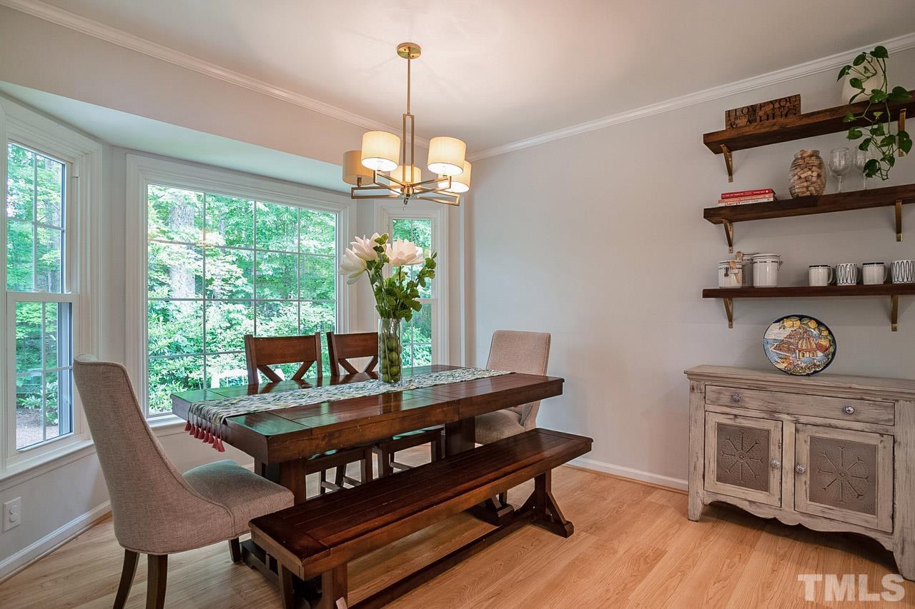 8105 Brumbley Place Raleigh, NC 27612 - Photo 11 of 23 a view of a dining room with furniture window and outside view