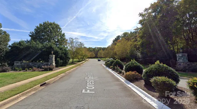 a view of a street with a building in the background