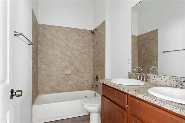 a kitchen with stainless steel appliances granite countertop a refrigerator sink and cabinets