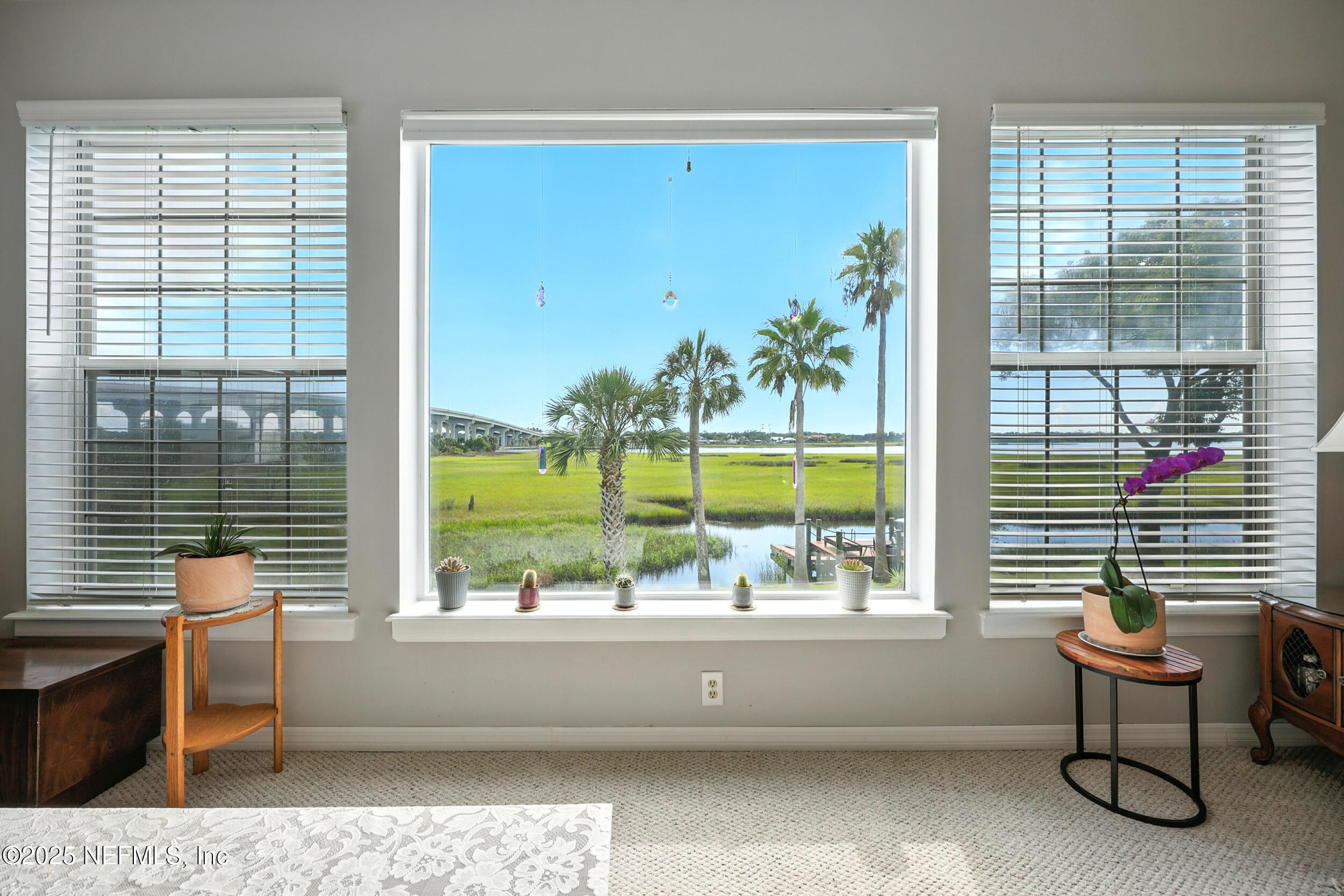 a living room with large windows