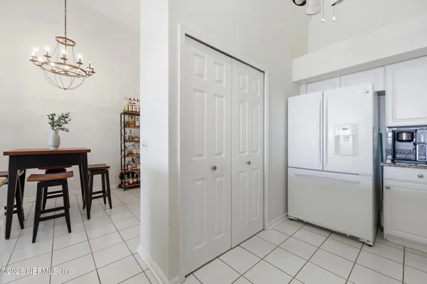 a spacious bathroom with a tub sink and mirror