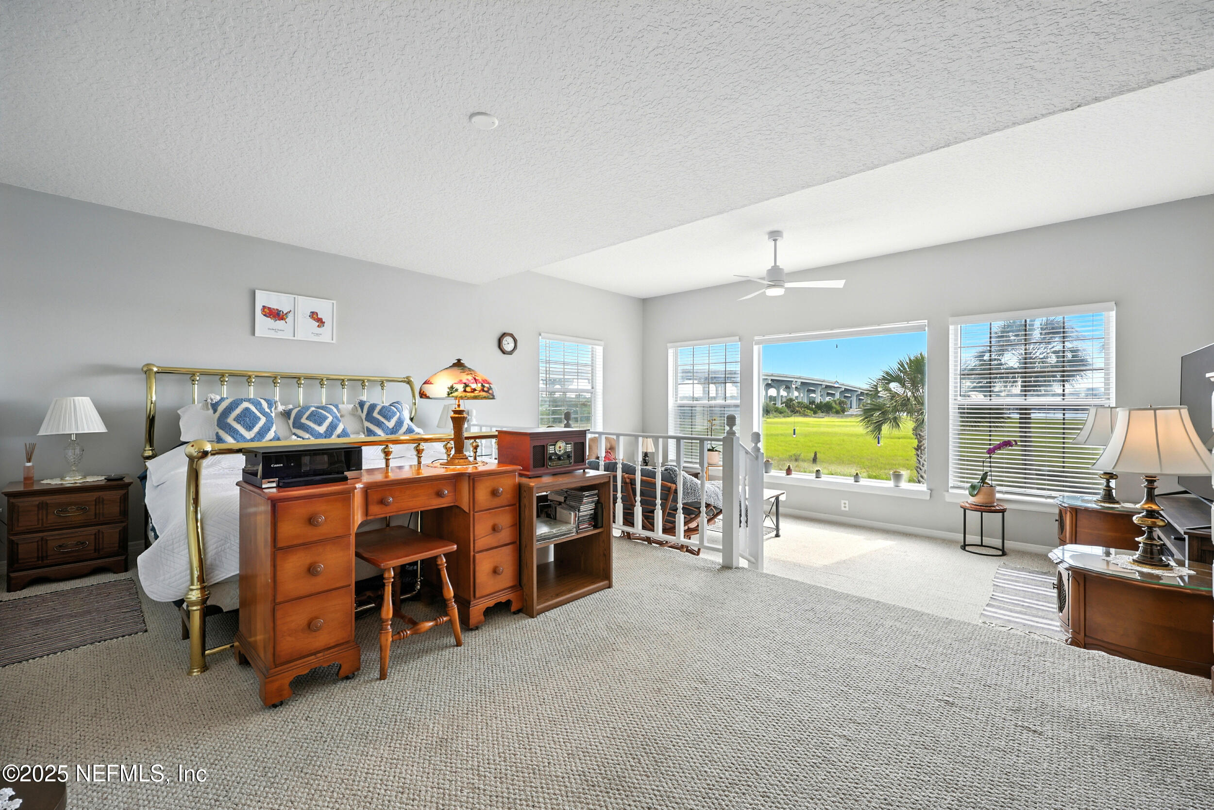 3331 Lighthouse Point Lane Jacksonville, FL 32250 - Photo 22 of 63 a bed room with furniture and a flat screen tv