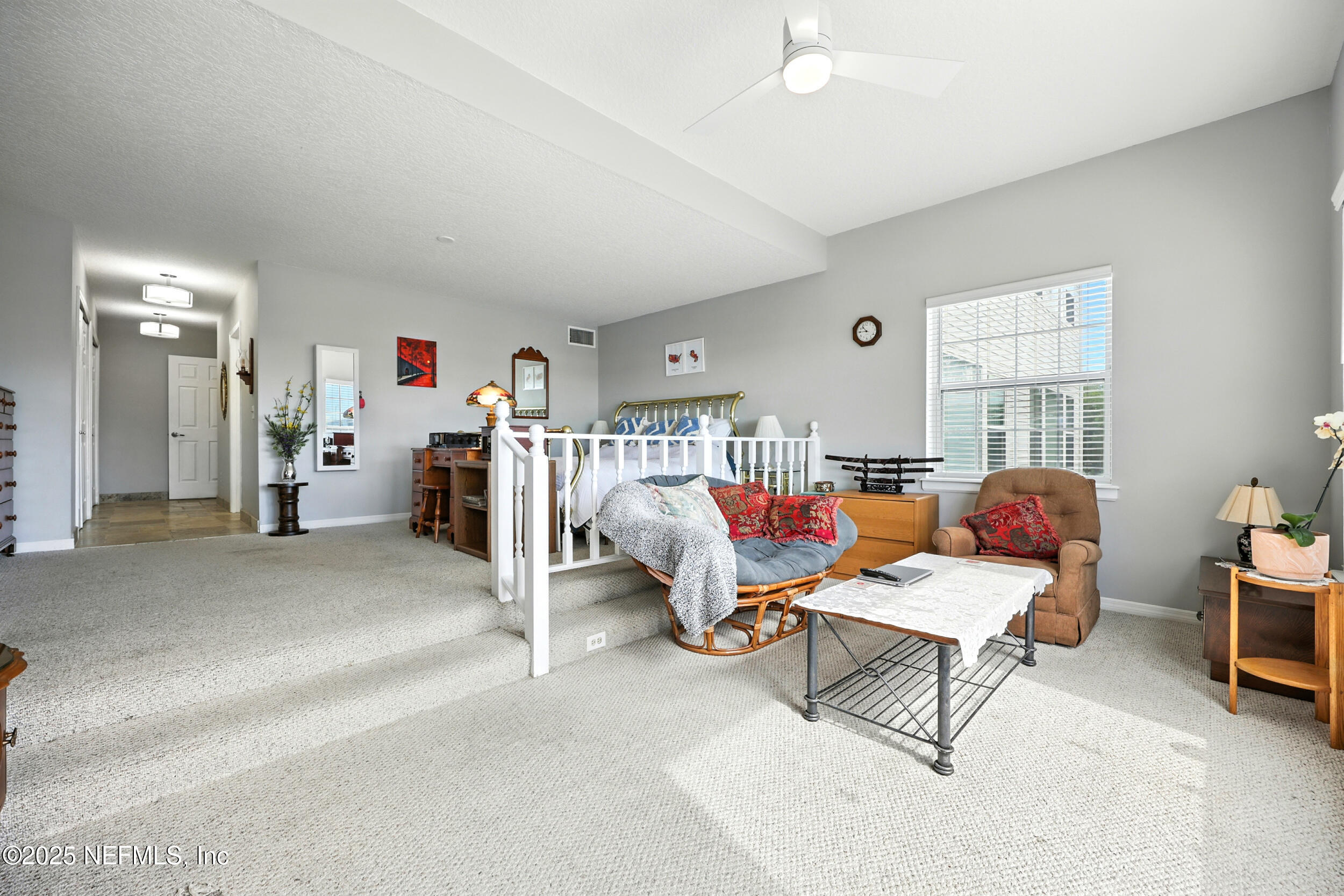 3331 Lighthouse Point Lane Jacksonville, FL 32250 - Photo 23 of 63 a living room with furniture and a wooden floor