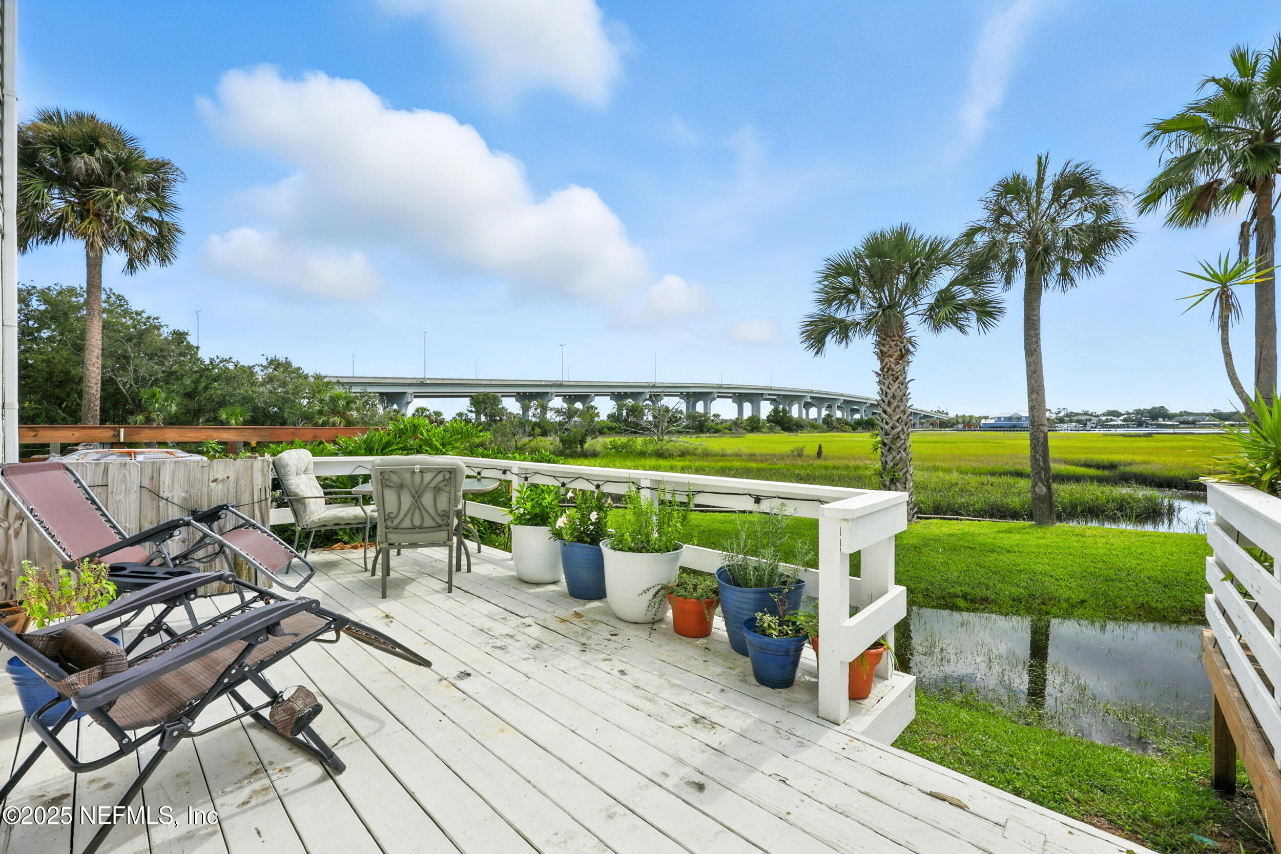 3331 Lighthouse Point Lane Jacksonville, FL 32250 - Photo 33 of 63 an outdoor sitting area with furniture and garden