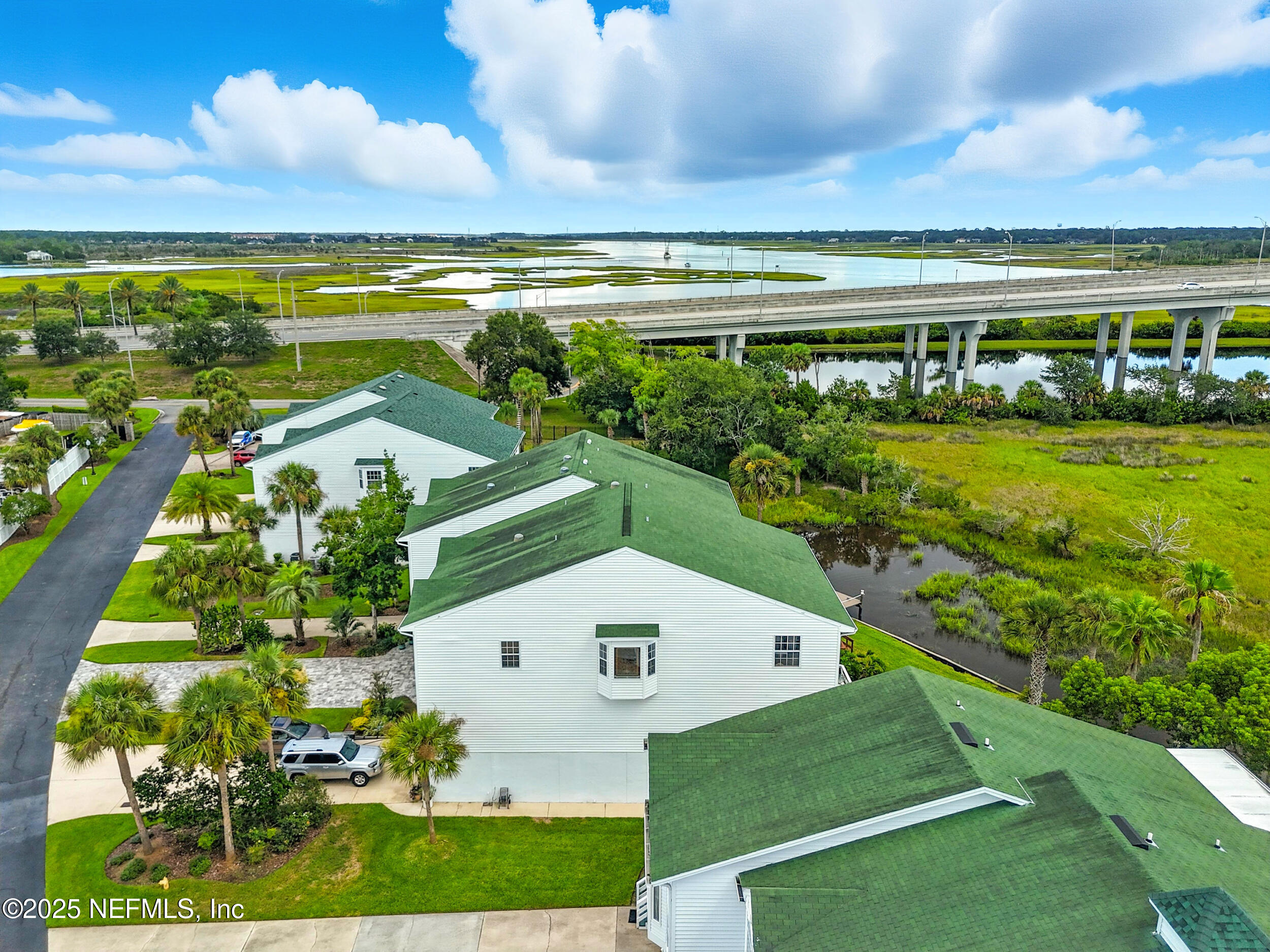 3331 Lighthouse Point Lane Jacksonville, FL 32250 - Photo 49 of 63 a view of a big yard with an outdoor seating and mountain view