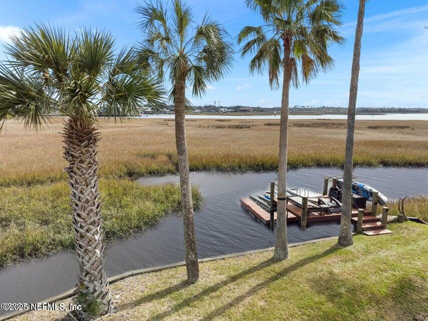 3331 Lighthouse Point Lane Jacksonville, FL 32250 - Photo 62 of 63 a view of a lake with a table and chairs