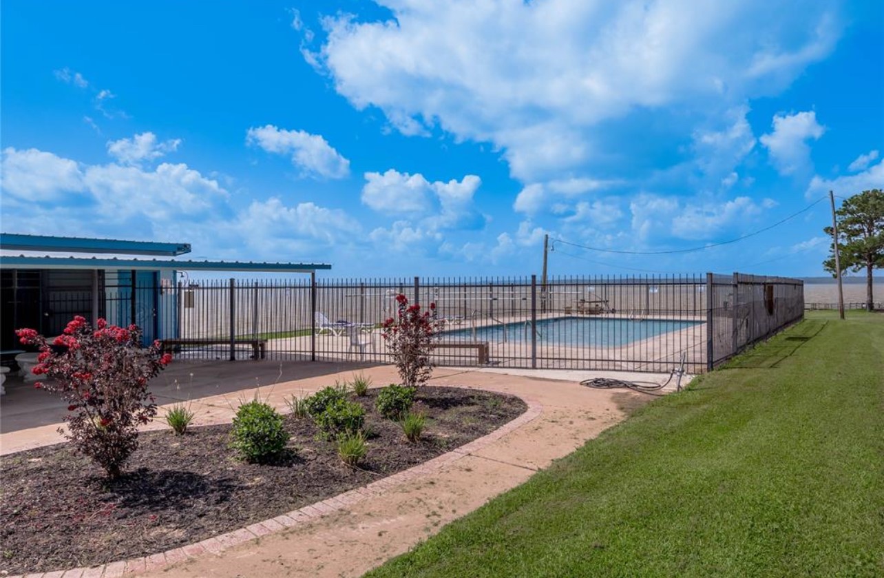 121 Lakeview Drive Point Blank, TX 77364 - Photo 8 of 10 a view of a backyard