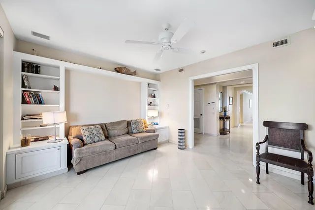 a view of living room with furniture and floor to ceiling window