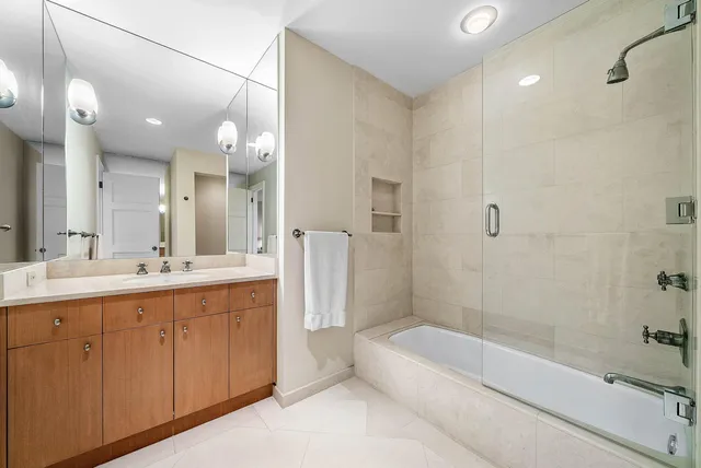 an aerial view of a pool a fireplace yard and mountain view in back