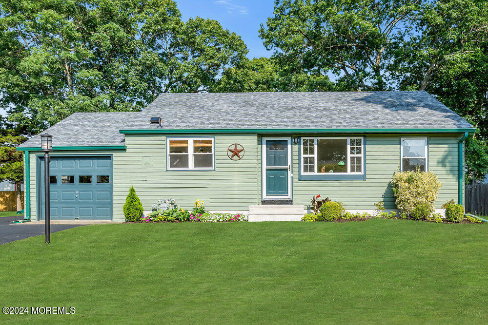 2117 Murray Road Point Pleasant, NJ 08742 - Photo 1 of 35 a front view of a house with a garden