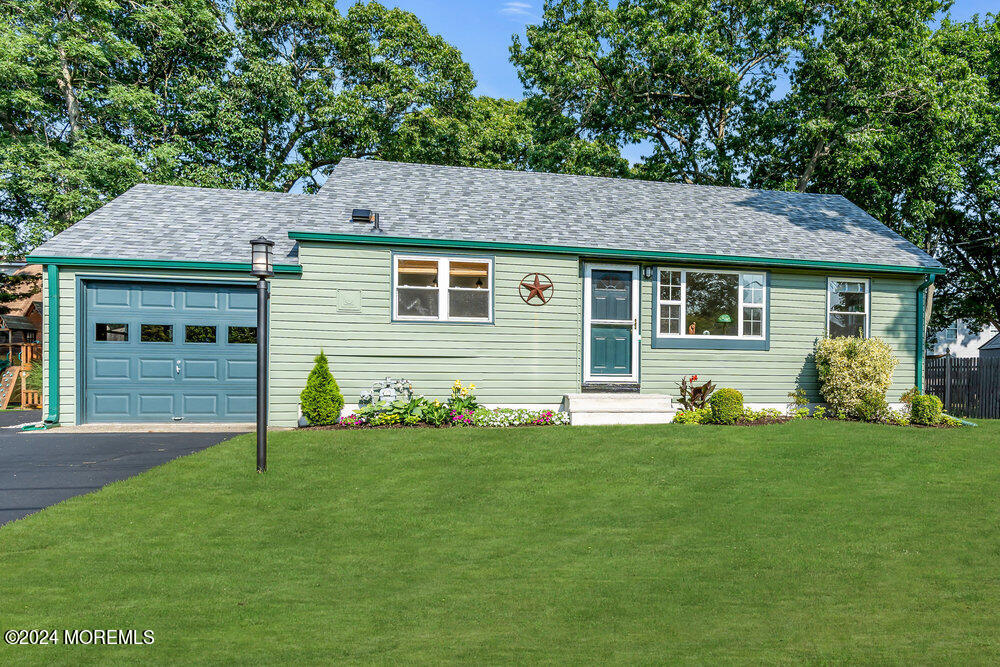 2117 Murray Road Point Pleasant, NJ 08742 - Photo 32 of 35 a front view of a house with a garden