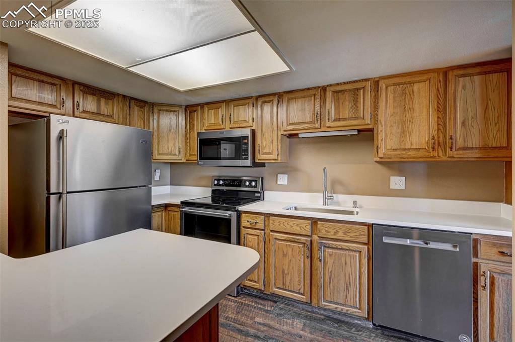 910 Fontmore Road, Unit B Colorado Springs, CO 80904 - Photo 12 of 32 a kitchen with a refrigerator stove and microwave