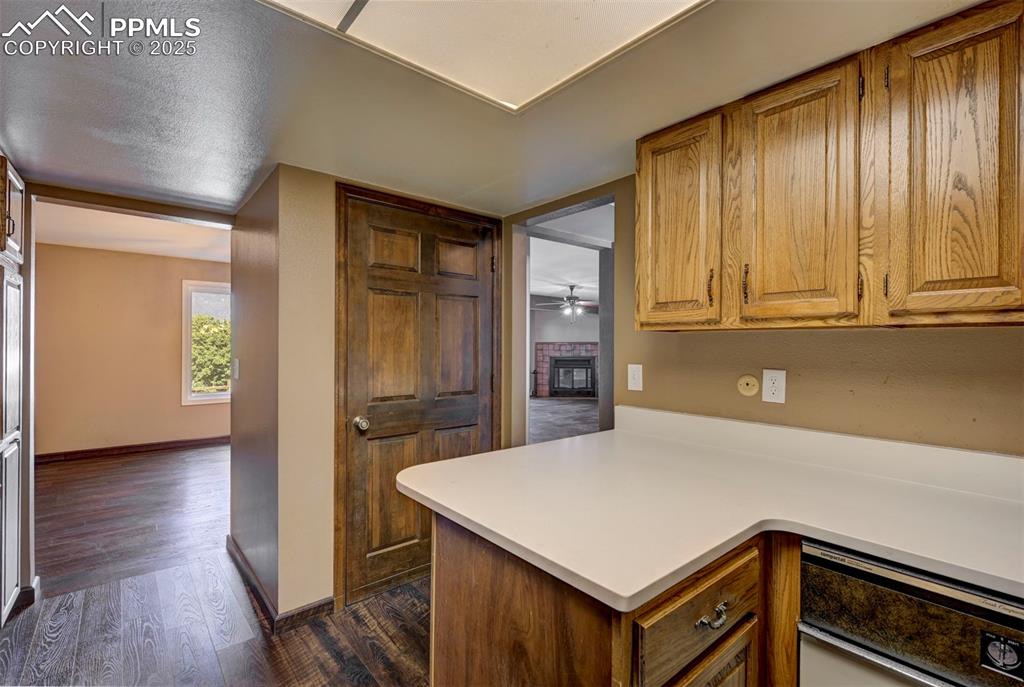 910 Fontmore Road, Unit B Colorado Springs, CO 80904 - Photo 13 of 32 a kitchen with a stove a refrigerator and a sink