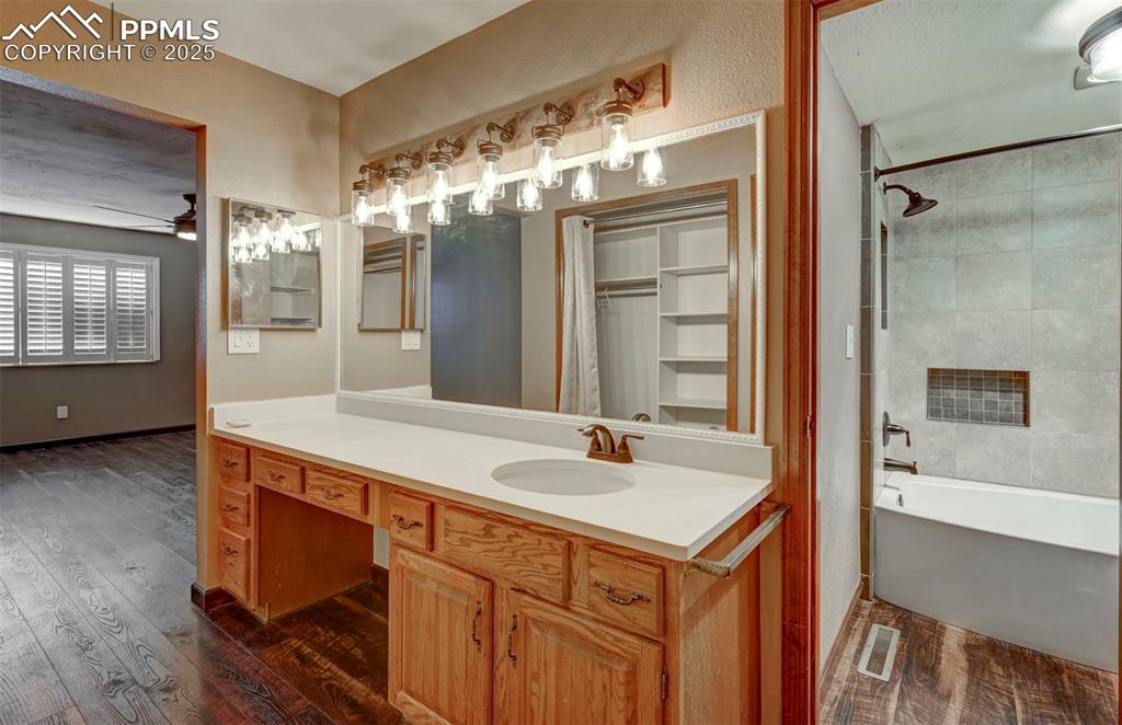 910 Fontmore Road, Unit B Colorado Springs, CO 80904 - Photo 20 of 32 a bathroom with a sink double vanity and a mirror