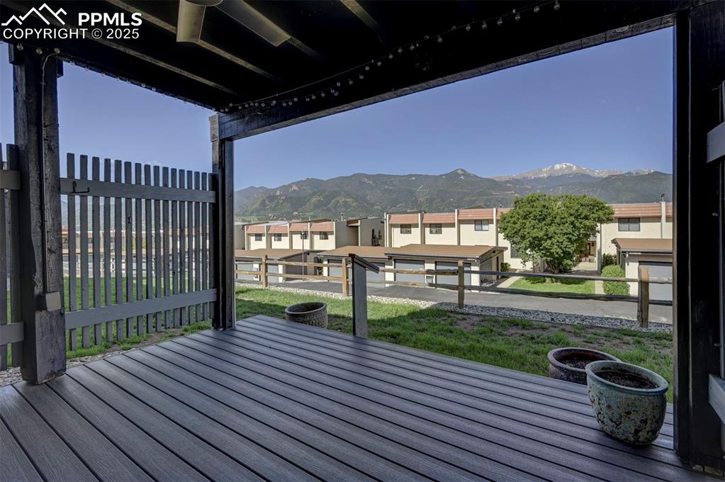 910 Fontmore Road, Unit B Colorado Springs, CO 80904 - Photo 25 of 32 a view of a balcony with chair and wooden floor