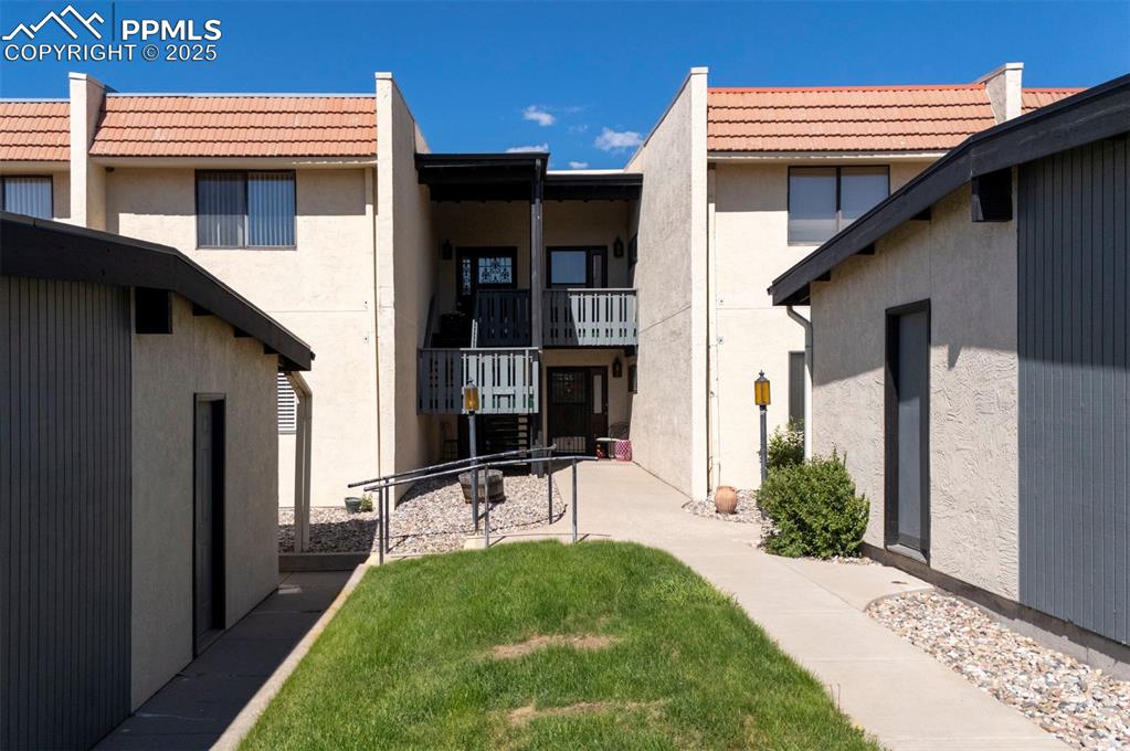 910 Fontmore Road, Unit B Colorado Springs, CO 80904 - Photo 29 of 32 a view of a house with a yard