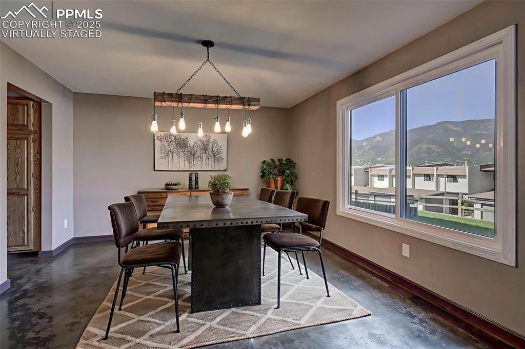 910 Fontmore Road, Unit B Colorado Springs, CO 80904 - Photo 7 of 32 a view of a dining room with furniture window and outside view