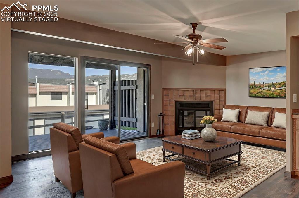 910 Fontmore Road, Unit B Colorado Springs, CO 80904 - Photo 9 of 32 a living room with furniture and a fireplace