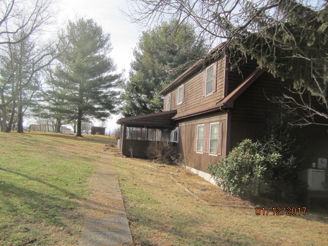 760 Buttermilk Spring Road Staunton, VA 24401 - Photo 19 of 20 a house with trees in front of it