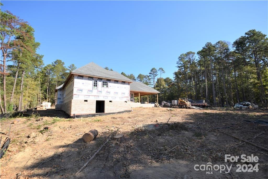 6506 Pargo Road Charlotte, NC 28216 - Photo 4 of 13 a front view of a house with a yard and garage