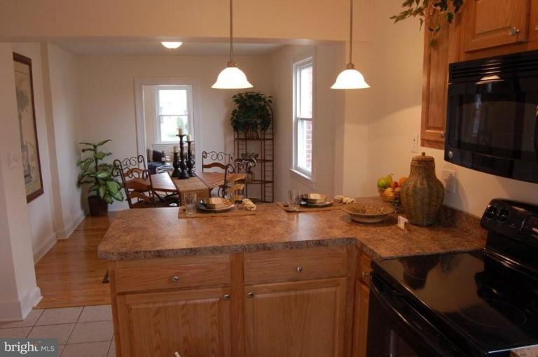 28 Crafton Road Essex, MD 21221 - Photo 2 of 13 a kitchen with sink and refrigerator