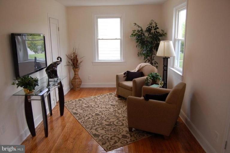 28 Crafton Road Essex, MD 21221 - Photo 3 of 13 a living room with furniture rug and wooden floor