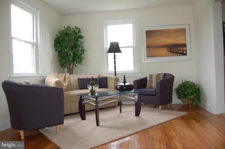 28 Crafton Road Essex, MD 21221 - Photo 4 of 13 a living room with furniture and a potted plant
