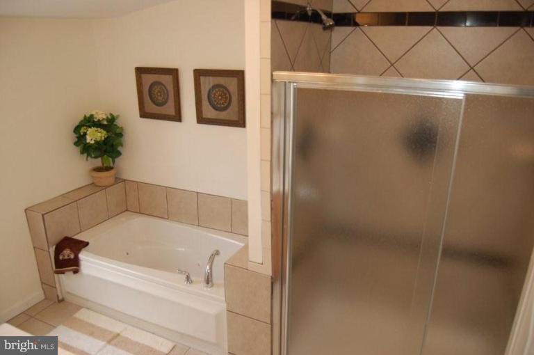 28 Crafton Road Essex, MD 21221 - Photo 10 of 13 a bathroom with a bathtub