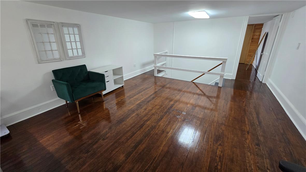 883 North Locust Street Hazleton, PA 18201 - Photo 63 of 83 Rich hardwood flooring extends throughout this versatile, open-concept living area.