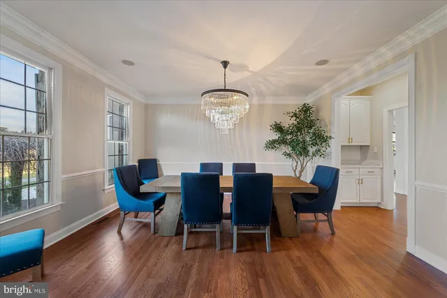 a living room with a bed furniture and a flat screen tv