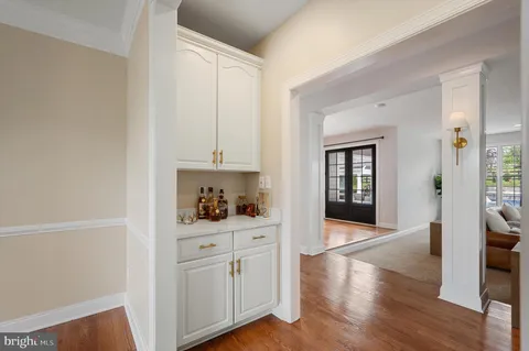a white bath tub sitting in a bathroom next to a window