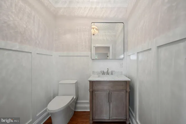 a white bath tub sitting in a bathroom next to a window