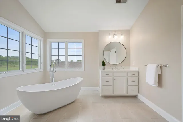 a bathroom with a sink a toilet and shower curtain