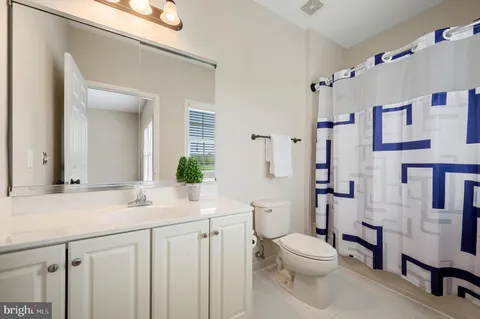 a view of backyard with swimming pool and patio