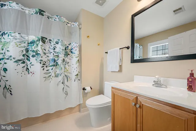an aerial view of a house with swimming pool and sitting area