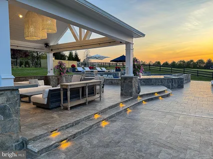 a view of a terrace with sitting area