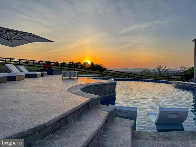 a view of a house with backyard and porch