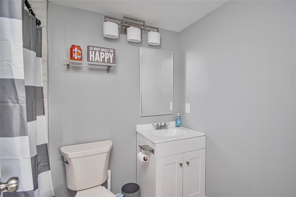 436 Fanshaw K, Unit 436 Boca Raton, FL 33434 - Photo 14 of 16 a bathroom with a sink and a toilet