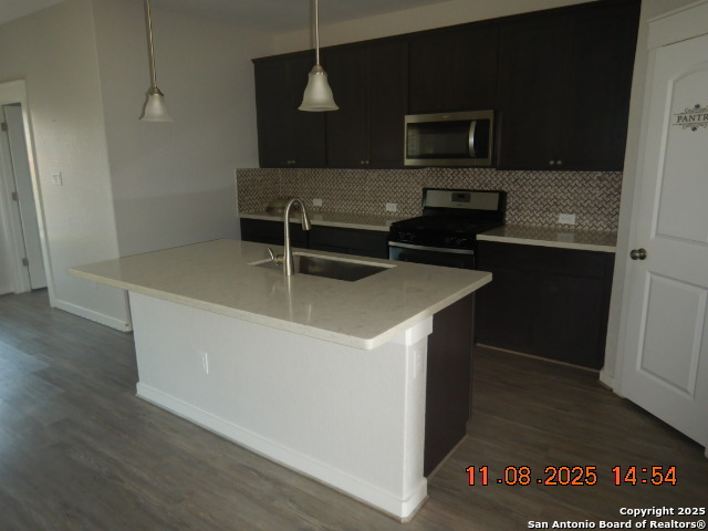 10639 Francisco Way Converse, TX 78109 - Photo 3 of 16 a kitchen with a sink and a microwave
